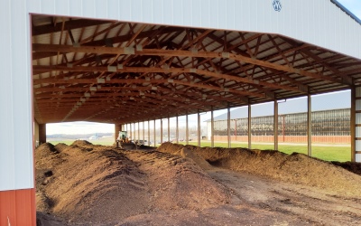 Manure compost piles under a open shed