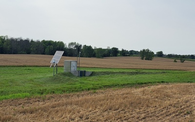edge-of-field monitor installed along the edge of a recently harvested crop field